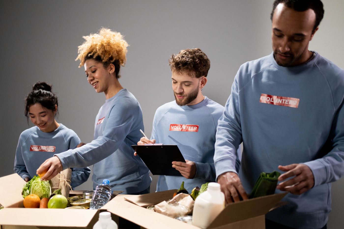 Volunteers packing boxes of donated food